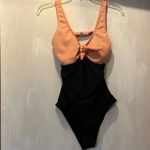 Pink and black one piece